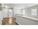 Second floor hallway with natural light and access to bedrooms and a bathroom at 3821 La Costa Way, Raleigh, NC 27610