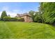 Spacious backyard with lush lawn, mature trees, and privacy fencing for outdoor enjoyment and recreation at 3994 Limerick Dr, Burlington, NC 27215