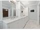 Primary bathroom showcasing dual sinks, marble counters, and a sleek, modern design at 3994 Limerick Dr, Burlington, NC 27215