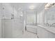 Bright bathroom with soaking tub, walk-in shower, and elegant marble finishes at 3994 Limerick Dr, Burlington, NC 27215