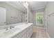 Bathroom featuring double sink vanity, tile floor, and neutral color scheme at 3994 Limerick Dr, Burlington, NC 27215