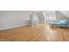 Spacious bonus room with hardwood floors, natural light, and comfortable seating area at 3994 Limerick Dr, Burlington, NC 27215
