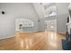 Spacious living room features hardwood floors, arched doorway, and views into the kitchen at 3994 Limerick Dr, Burlington, NC 27215