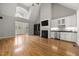 Bright living room with vaulted ceiling, fireplace, built-ins, and views of the entry at 3994 Limerick Dr, Burlington, NC 27215