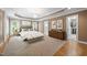 Staged primary bedroom boasts a tray ceiling, neutral colors, and walk-in closet at 3994 Limerick Dr, Burlington, NC 27215