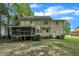 Backyard with patio, deck, and fenced yard at 418 Old Scarborough Ln, Garner, NC 27529