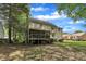 Backyard with patio, deck, and fenced yard at 418 Old Scarborough Ln, Garner, NC 27529