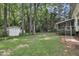 Backyard with patio, deck, and fenced yard at 418 Old Scarborough Ln, Garner, NC 27529
