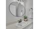 Updated bathroom vanity with a modern mirror, fixtures, and decor at 418 Old Scarborough Ln, Garner, NC 27529