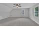 Large bedroom with vaulted ceiling, carpet, ceiling fan, and window for natural light at 418 Old Scarborough Ln, Garner, NC 27529