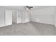 Carpeted bedroom with vaulted ceiling, open doorway, closet, and ceiling fan at 418 Old Scarborough Ln, Garner, NC 27529