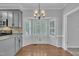 Breakfast nook in the kitchen with lots of light and white shuttered windows at 418 Old Scarborough Ln, Garner, NC 27529