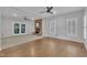 Spacious living room with a fireplace, hardwood floors, and lots of natural light at 418 Old Scarborough Ln, Garner, NC 27529