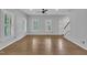 Bright and open living room features hardwood floors and lots of natural light at 418 Old Scarborough Ln, Garner, NC 27529