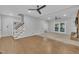 Spacious living room featuring hardwood floors, fireplace, and natural light from screened porch entrance at 418 Old Scarborough Ln, Garner, NC 27529