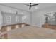 Open concept living room with hardwood flooring, neutral carpet, lots of natural light and open access to the kitchen at 418 Old Scarborough Ln, Garner, NC 27529