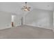 Spacious main bedroom featuring vaulted ceilings, neutral carpet and paint, and access to the ensuite bathroom at 418 Old Scarborough Ln, Garner, NC 27529