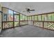 Enclosed sunroom offers a relaxing space with carpet, a ceiling fan, and wooden lattices at 418 Old Scarborough Ln, Garner, NC 27529