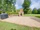 Expansive backyard with brick patio and stone fireplace great for entertaining or relaxing at 4200 Harmony Church Rd, Efland, NC 27243