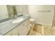 Clean bathroom featuring a large sink, vanity, toilet and tiled shower at 4200 Harmony Church Rd, Efland, NC 27243