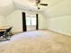 Bright bedroom featuring vaulted ceiling, ceiling fan, and large windows at 4200 Harmony Church Rd, Efland, NC 27243