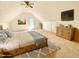 Cozy bedroom featuring a vaulted ceiling, comfy bed, and dresser at 4200 Harmony Church Rd, Efland, NC 27243