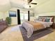 Cozy bedroom with modern decor, large window, and ceiling fan at 4200 Harmony Church Rd, Efland, NC 27243
