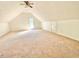 Large, empty bedroom with vaulted ceilings and natural light at 4200 Harmony Church Rd, Efland, NC 27243