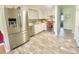 Modern kitchen with stainless steel appliances, white cabinets, and plenty of counter space at 4200 Harmony Church Rd, Efland, NC 27243