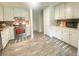 Bright kitchen features ample cabinet space, stainless steel appliances, and modern countertops at 4200 Harmony Church Rd, Efland, NC 27243
