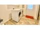 Convenient laundry room featuring a washing machine, dryer and tile flooring at 4200 Harmony Church Rd, Efland, NC 27243