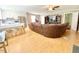 Spacious living room featuring a large sectional sofa, ceiling fan, and wood flooring at 4200 Harmony Church Rd, Efland, NC 27243