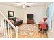 Cozy living room with hardwood floors, plush seating, and abundant natural light at 4200 Harmony Church Rd, Efland, NC 27243