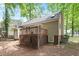Exterior view of the back of the home with a fenced yard and deck at 4401 Liverpool Ln, Raleigh, NC 27604