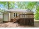 Exterior view of the back of the home with a fenced yard and deck at 4401 Liverpool Ln, Raleigh, NC 27604
