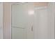 Bathroom shower with glass doors and plastic square tiles at 4401 Liverpool Ln, Raleigh, NC 27604