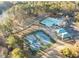Aerial view featuring the community pool, tennis courts, and lake at 4401 Liverpool Ln, Raleigh, NC 27604