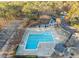 Aerial shot of the community pool with trees and parking at 4401 Liverpool Ln, Raleigh, NC 27604