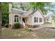 Well-maintained home with a neatly landscaped yard, brick accents, and neutral siding at 4401 Liverpool Ln, Raleigh, NC 27604