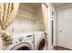 Bright laundry room with LG washer and dryer and wire shelving at 4401 Liverpool Ln, Raleigh, NC 27604