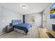 Bedroom featuring a desk, mounted television, and built-in shelves at 507 Littleport Dr, Rolesville, NC 27571