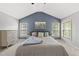 Bright bedroom features a vaulted ceiling, two windows, and a neutral color palette at 507 Littleport Dr, Rolesville, NC 27571