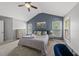 A bedroom features a vaulted ceiling, ceiling fan, and two windows for natural light at 507 Littleport Dr, Rolesville, NC 27571