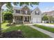 Beautiful two-story home with stone accents, a manicured lawn, and a two-car garage at 507 Littleport Dr, Rolesville, NC 27571