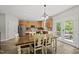 Bright kitchen and dining area featuring stainless steel appliances, and access to the outdoor deck at 507 Littleport Dr, Rolesville, NC 27571