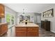 Kitchen featuring center island, stainless appliances, and open layout connecting the dining area and living room at 507 Littleport Dr, Rolesville, NC 27571