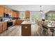 Well-equipped kitchen boasts stainless steel appliances, an island, and a dining area with backyard access at 507 Littleport Dr, Rolesville, NC 27571