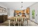 Well-lit kitchen with stainless steel appliances, a dining area, and access to the outdoor space at 507 Littleport Dr, Rolesville, NC 27571