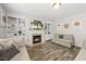 Comfortable living room featuring a fireplace, built-in bookshelves, and ample seating at 507 Littleport Dr, Rolesville, NC 27571