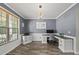 Well-lit home office with modern desk setup, custom cabinetry, and large window for natural light at 507 Littleport Dr, Rolesville, NC 27571